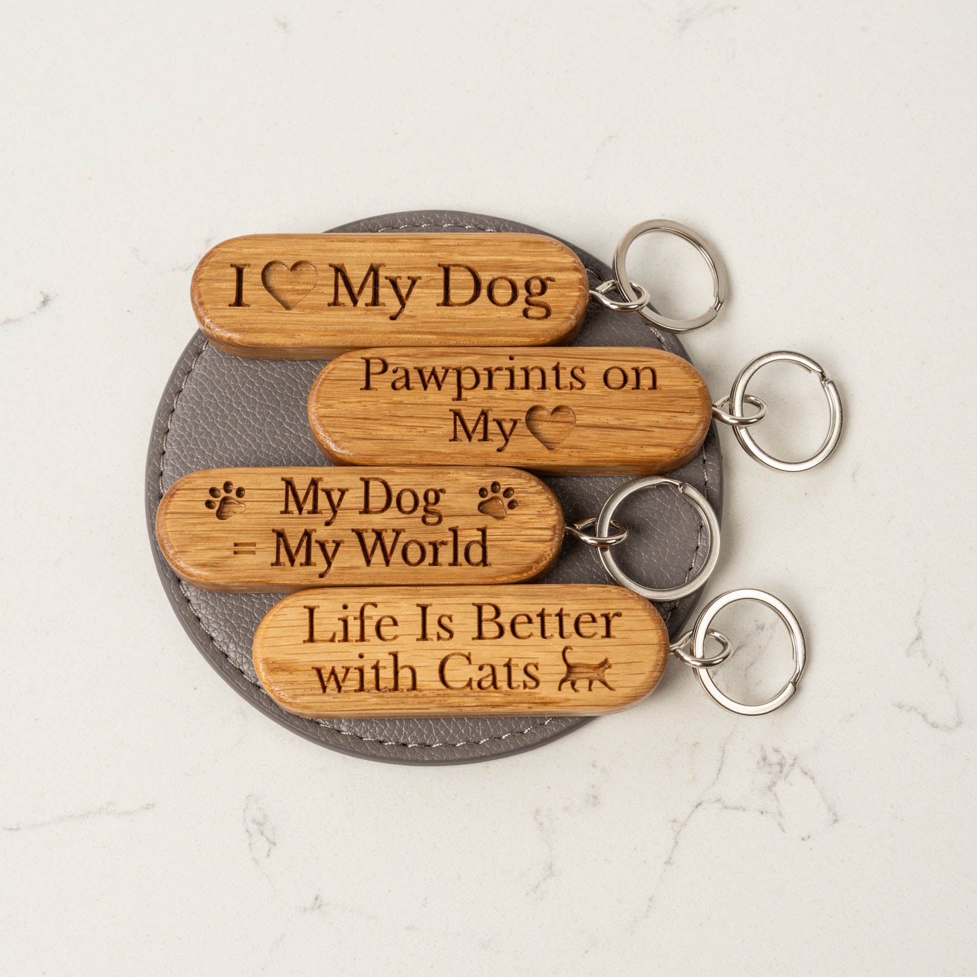Hand-made oak wooden keyring with dog and cat slogans engraved