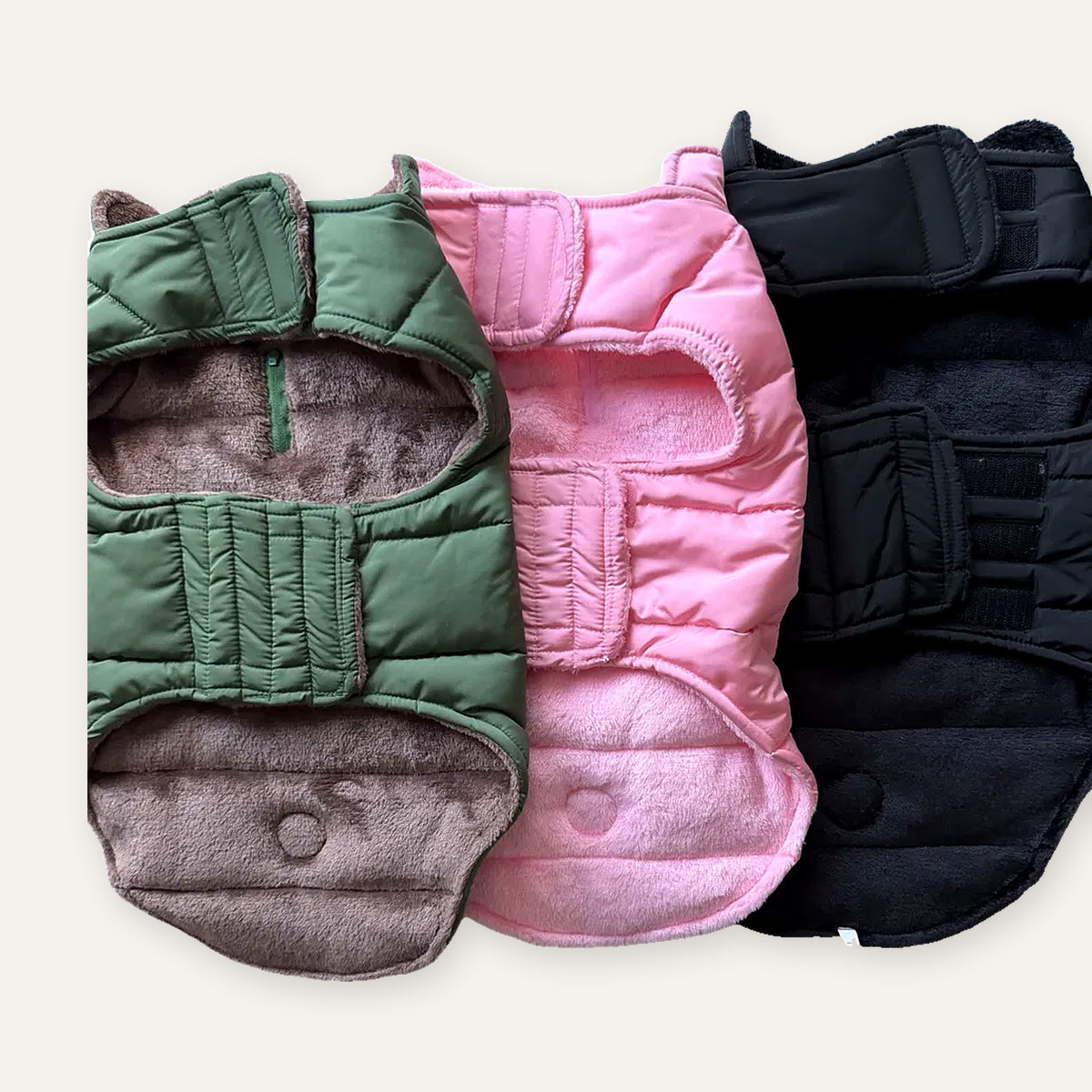 Colour-matched plush fleece linings and adjustable straps on all three dog puffer coats