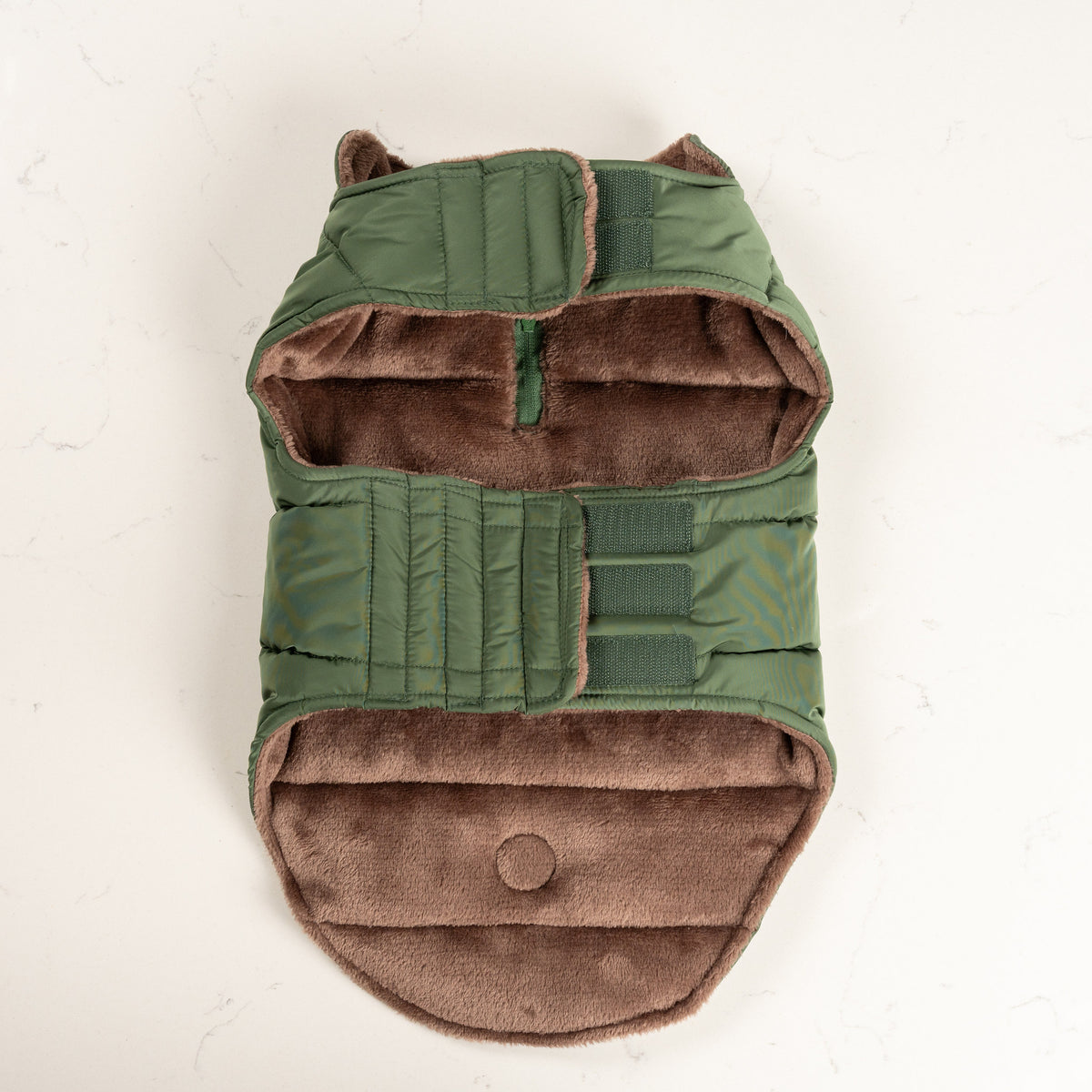 Woodland Green dog puffer coat fastened, showing the plush taupe fleece lining inside